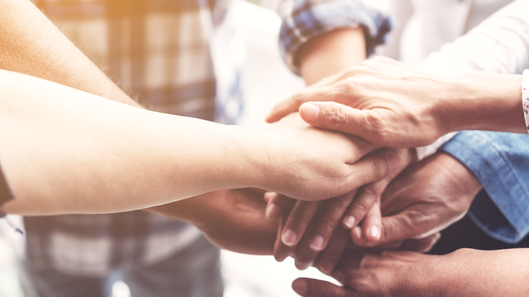 hands in center representing community