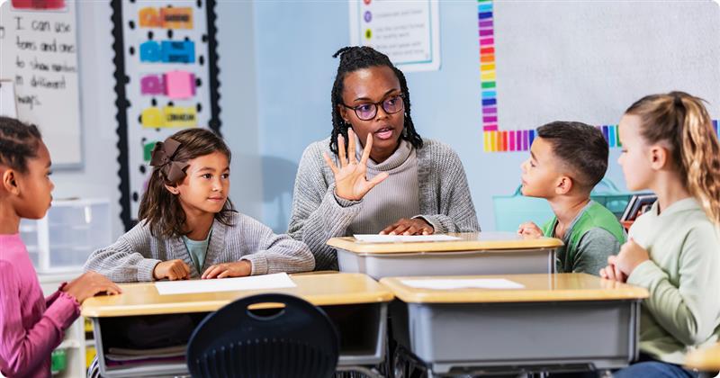 Paraeducator working with children in a classroom